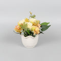 Spring flowers in ceramic, scalloped edge vase